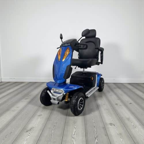Photo showing a three-quarter view of the left of a Blue, Monarch Vogue XL Second hand mobility scooter.