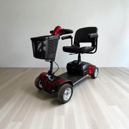 Photo showing a three-quarter view of the left side and front of a Red and Black, Pride Gogo Elite Traveller Sport Second hand mobility scooter.