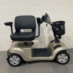 Champagne Coloured 4 Wheeled Scooter with Swivel Seat Turned for Transfer Careco Victory
