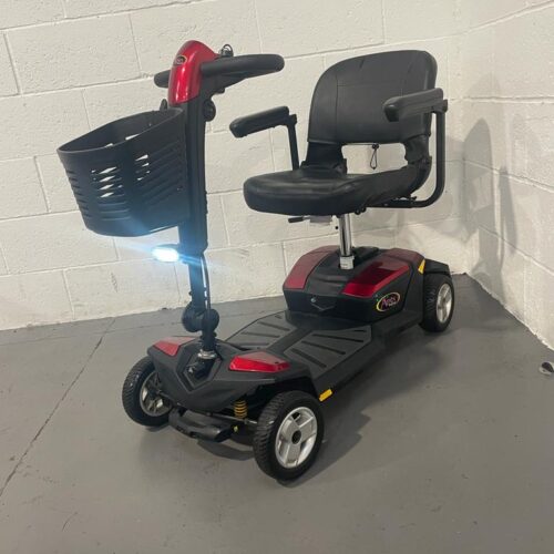 dark red and black 4 wheeled scooter profile picture with basket and headlight