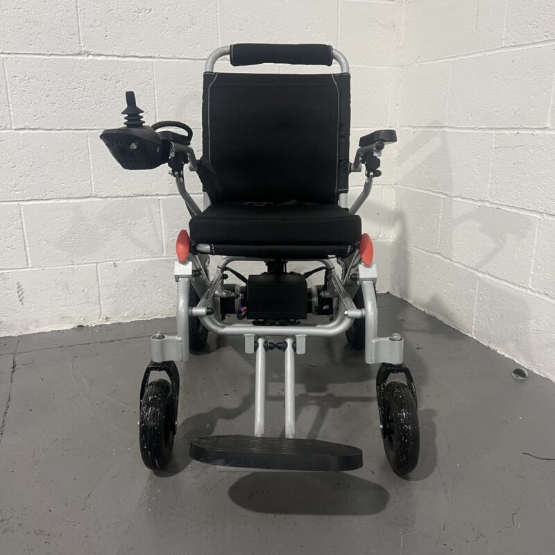 Front View of a Silver Second-hand Class 2 Transportable Light-weight Foldable Majestic Buvan Powered Wheelchair Majestic Buvan Powerchair