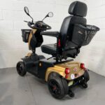 Three-quarter View of the Left and Rear of a Second-hand Gold Freerider Fr1 Cruiser Mobility Scooter. Freerider Fr1 Cruiser