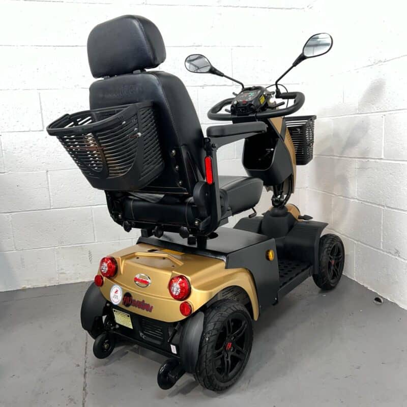 Three-quarter View of the Right and Rear of a Second-hand Gold Freerider Fr1 Cruiser Mobility Scooter. Freerider Fr1 Cruiser
