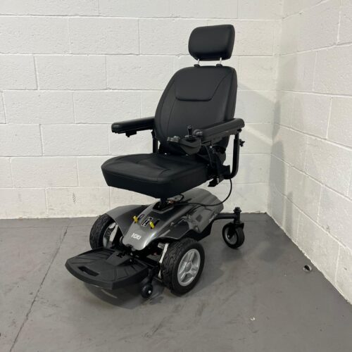 Three-quarter view of the right and front of a second-hand silver and black I-Go Zenith Pro powered wheelchair.