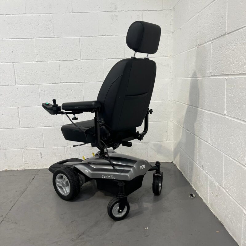 Three-quarter View of the Left and Rear of a Second-hand Silver and Black I-go Zenith Pro Powered Wheelchair. I-go Zenith Pro