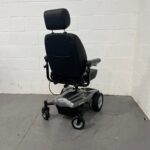 Three-quarter View of the Right and Rear of a Second-hand Silver and Black I-go Zenith Pro Powered Wheelchair. I-go Zenith Pro