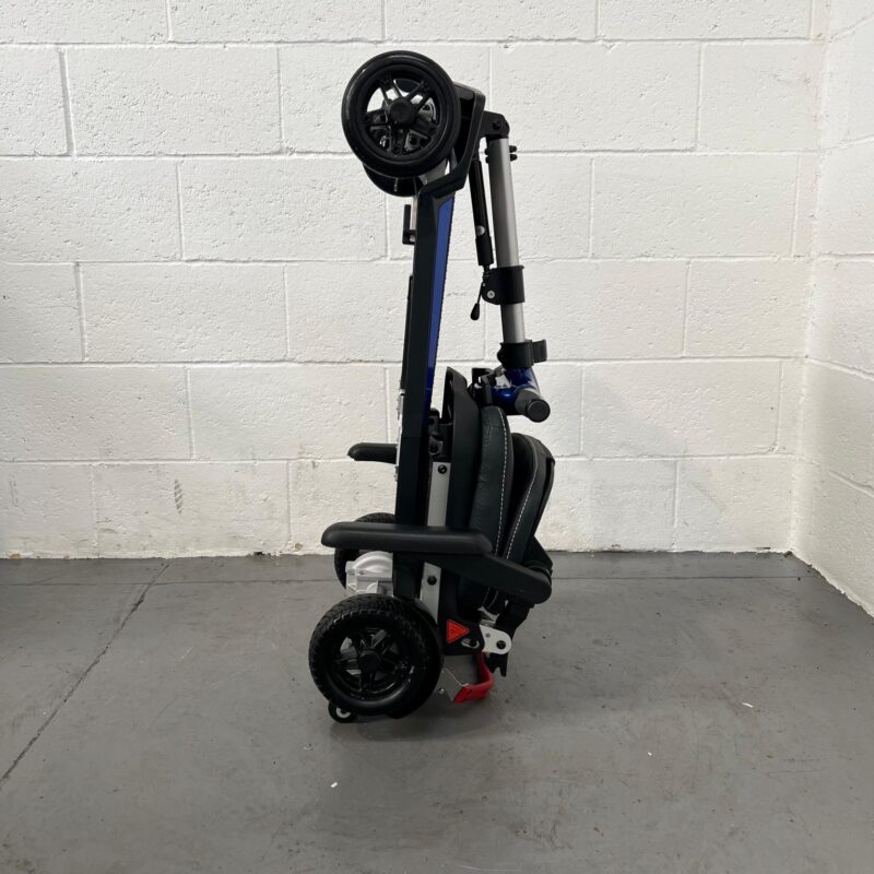 View of the Side of a Folded Second-hand Lightweight Folding Blue and Black Mobifree Folding Mobility Scooter. Mobifree Folding Scooter Blue (2024)