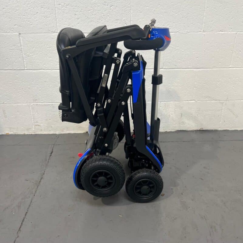 View of the Side of a Folded Second-hand Blue Optimus Automatic Folding Mobility Scooter. Optimus Automatic Folding Scooter