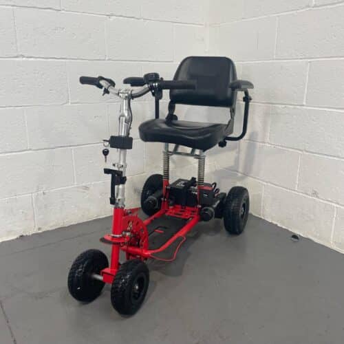 Three-quarter view of the left and front of a second-hand three-wheeled red Supascoota Sport XL mobility scooter.