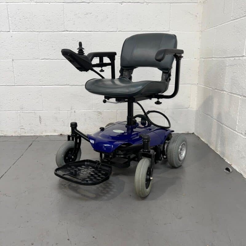 Photo Showing a Three-quarter View of the Left Side and Front of a Used, Blue and Black Careco Fenix Second-hand Powerchair. Careco Fenix Powerchair