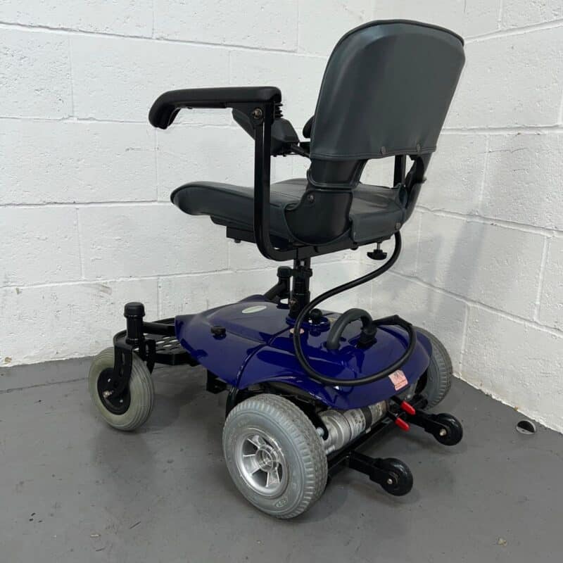 Photo Showing a Three-quarter View of the Left Side and Rear of a Used, Blue and Black Careco Fenix Second-hand Powerchair. Careco Fenix Powerchair