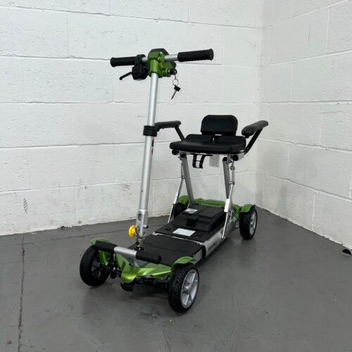 Photo Showing a Three-quarter View of the Left Side and Front off a Green and Black, Used Careco Minimus Second-hand Mobility Scooter. Used Mobility Scooter Shop | Second Hand Mobility Scooters!