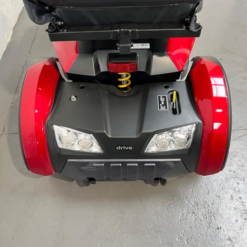 Close-up View of the Rear of a Red, 8mph Road-legal Drive Cobra Mobility Scooter. Shows the Scooter is Fitted with Rear Suspension and a Handbrake. Drive Cobra (red)