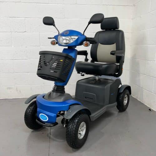 Three-quarter view of the left and front of a blue 8mph second-hand Excel Galaxy 2 mobility scooter.