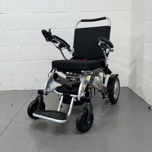 Photo Showing Three-quarter View of the Left Side and Front of a Used Silver and Black Freedom Chair A06l Second-hand Power Chair. Used Mobility Scooter Shop | Second Hand Mobility Scooters!