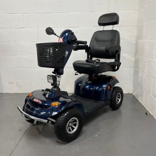 Three-quarter view of the left side and front of a dark blue second-hand Freerider Kensington S mobility scooter.