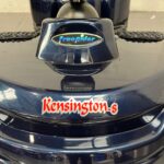 Close-up of the Freerider and Kensington Logos Fixed to the Front of a Dark Blue Second-hand Freerider Kensington S Mobility Scooter. Freerider Kensington S