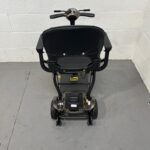 a View of the Rear of a Second-hand Gold and Black Globe Trotter Edrive Automatic Folding Mobility Scooter. One Rehab Globetrotter