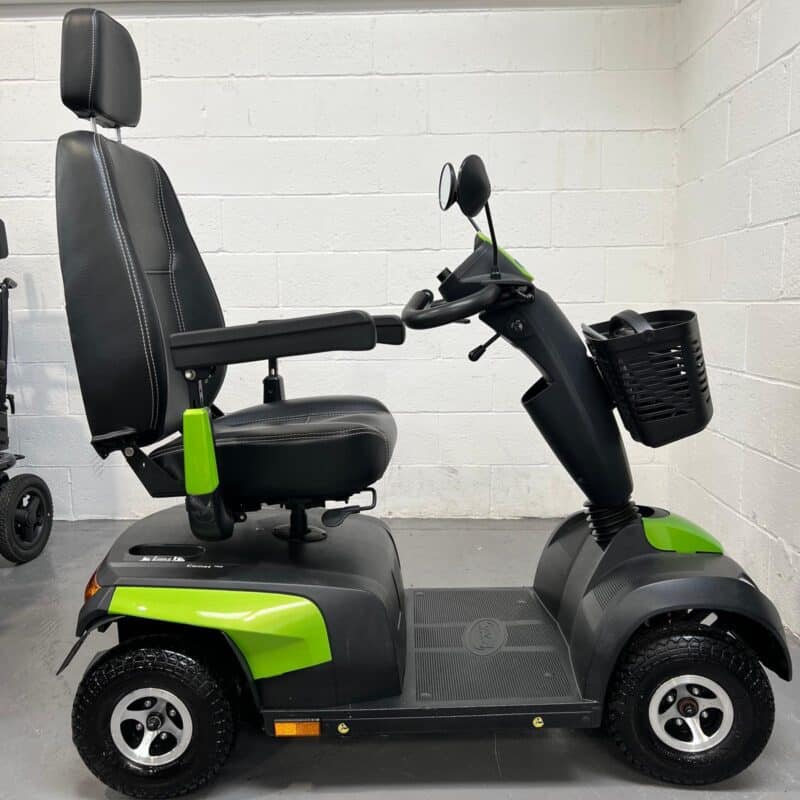 View of the Right Side of a Green and Black, 8mph, Road-legal, Second-hand Invacare Comet Pro Mobility Scooter. Invacare Comet Pro