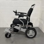 Left Side View of a Second-hand Silver and Black Kwk D09 Powerchair. Kwk D09 Powerchair