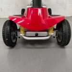Close-up View of the Front of a Second-hand Red One Rehab Illusion Transportable Mobility Scooter. It Shows the Front Bumber and Suspension. One Rehab Illusion (red)