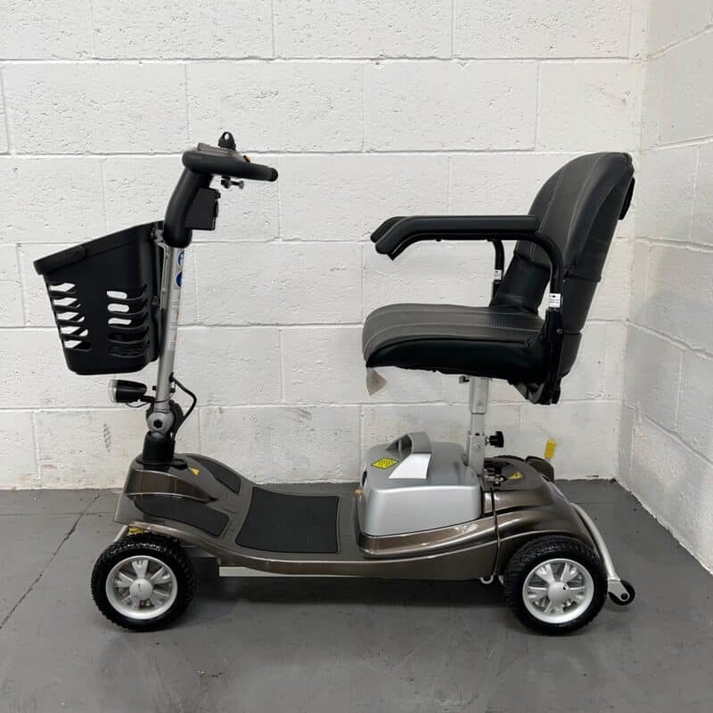 Photo of the Left Side of a Used Bronze and Black One Rehab Illusion Second-hand Mobility Scooter. One Rehab Illusion