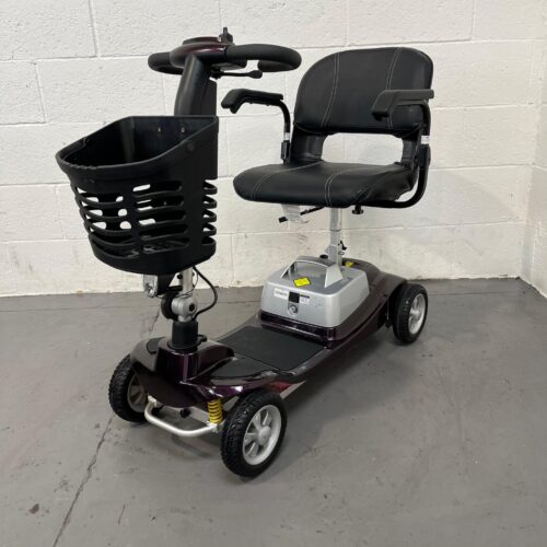 Three-quarter View of the Left and Front of a Second-hand Purple One Rehab Illusion Transportable Mobility Scooter. Used Mobility Scooter Shop | Second Hand Mobility Scooters!