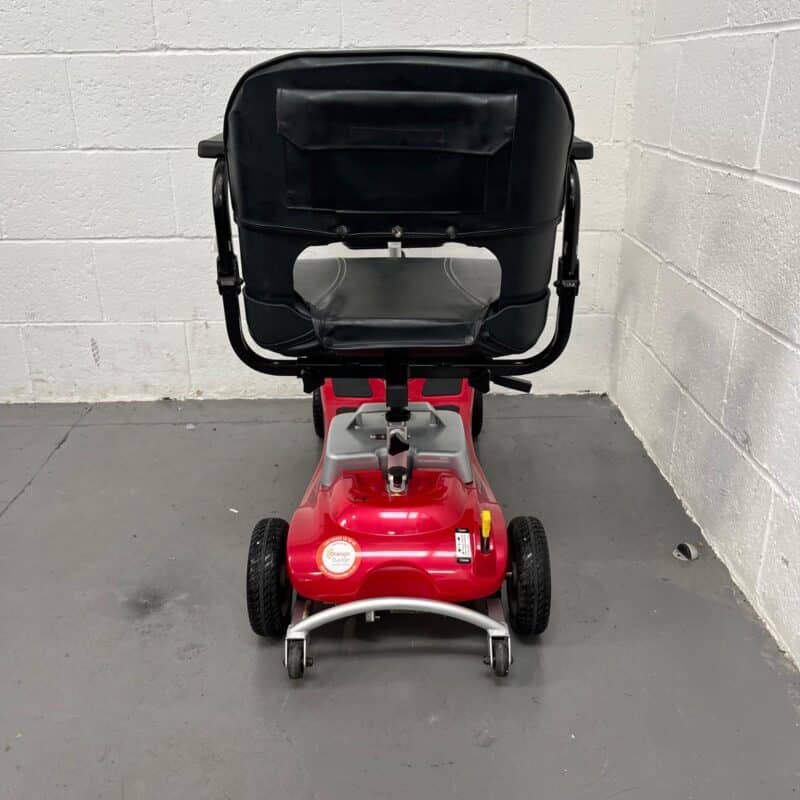 View of the Rear of a Second-hand Red One Rehab Illusion Transportable Mobility Scooter. One Rehab Illusion (red)