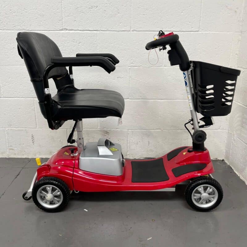 View of the Right-hand Side of a Second-hand Red One Rehab Illusion Transportable Mobility Scooter. One Rehab Illusion (red)