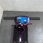 View of the Controls of a Purple 4mph Folding Second-hand One Rehab Q Fold Mobility Scooter. One Rehab Q Fold