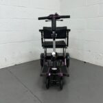 View of the Front of a Purple 4mph Folding Second-hand One Rehab Q Fold Mobility Scooter. One Rehab Q Fold