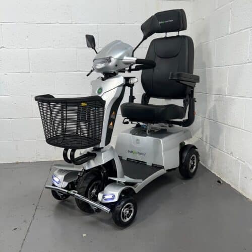 Three-quarter view of the left side and front of a silver, 8mph road-legal second-hand Quingo Vitess 2 mobility scooter.