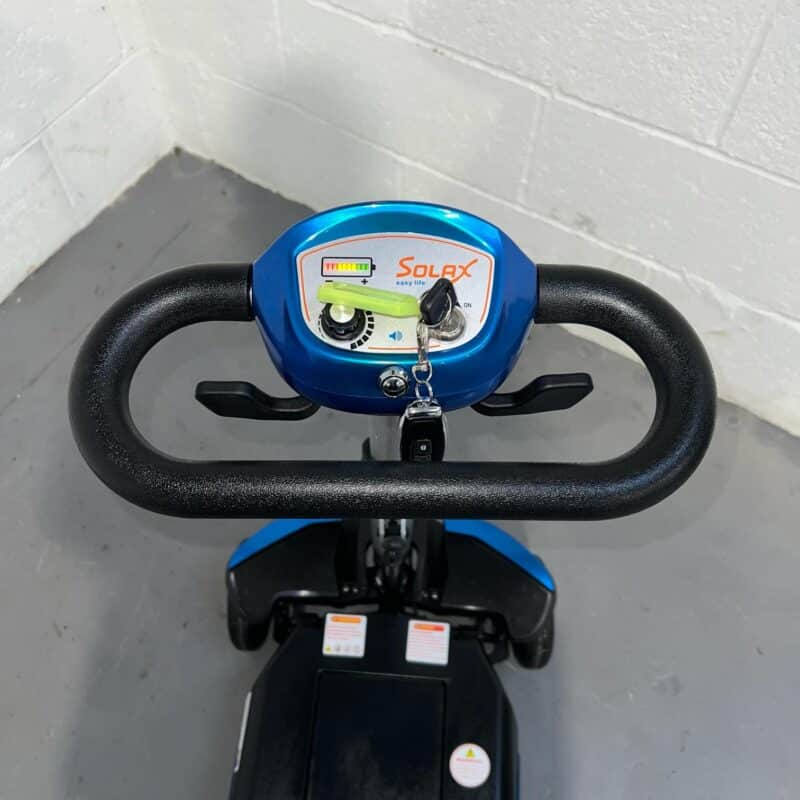 View of Handlebars and Controls of a Blue 4mph Automatic Folding Second-hand Solax Autofold Mobility Scooter. Solax Autofold (blue)