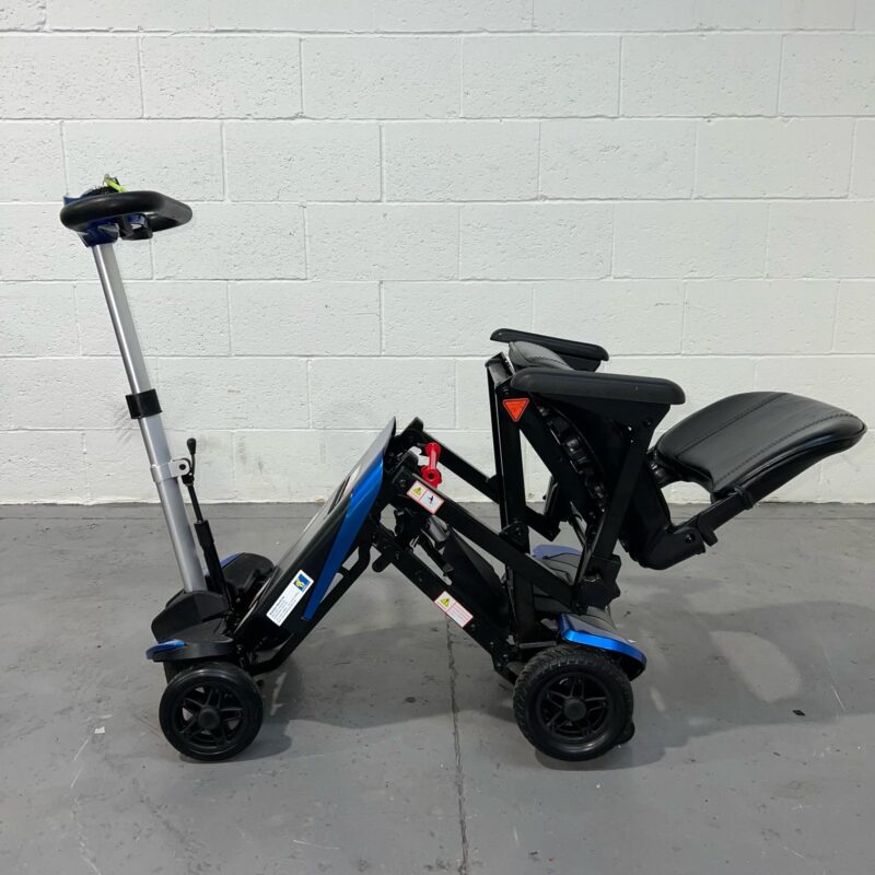 View of the Left Side of a Half-folded Blue 4mph Automatic Folding Second-hand Solax Autofold Mobility Scooter. Solax Autofold (blue)
