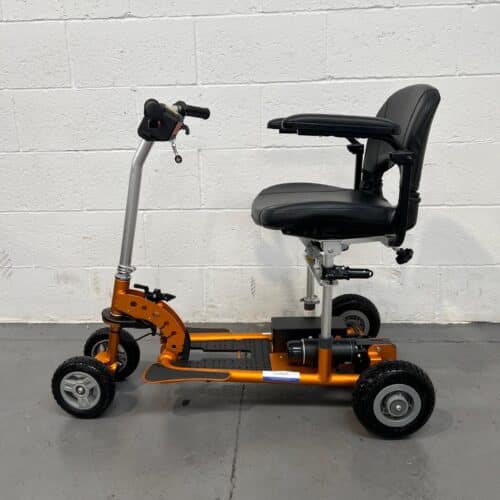 Photo of the Left Side of a Used Bronze and Black Supascoota Supalite 4 Second-hand Mobility Scooter. Used Mobility Scooter Shop | Second Hand Mobility Scooters!