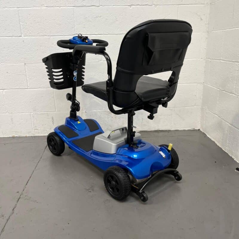 Photo Showing a Three-quarter View of the Left Side and Rear of a Blue Clearwell Aguna Comfort Second-hand Mobility Scooter. Clearwell Aguna Lithium