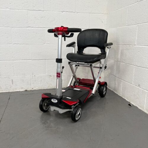 Photo Showing a Three-quarter View of the Left Side and Front of a Red and Black, Autofold Elite Second-hand Mobility Scooter. Used Mobility Scooter Shop | Second Hand Mobility Scooters!