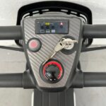 Photo Showing a Close-up of the Controls on a Purple and Black, Motion Healthcare Evolite Second-hand Mobility Scooter. Motion Healthcare Evolite