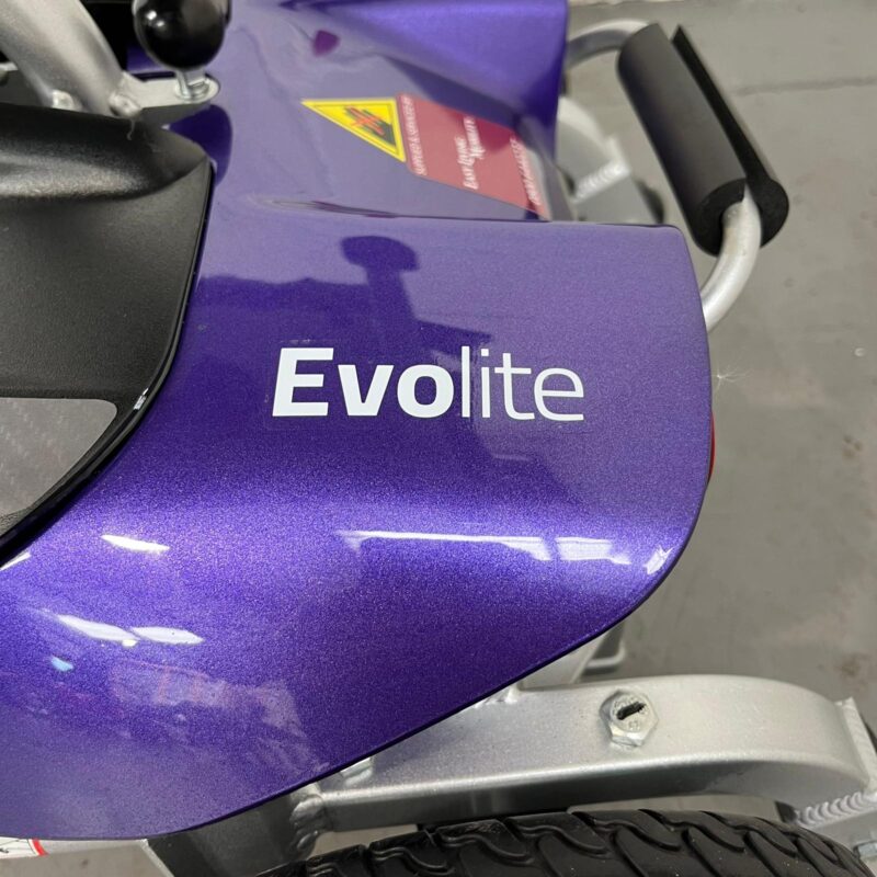Photo of the Evolite Logo on the Back of a Purple and Black, Motion Healthcare Evolite Second-hand Mobility Scooter. Motion Healthcare Evolite