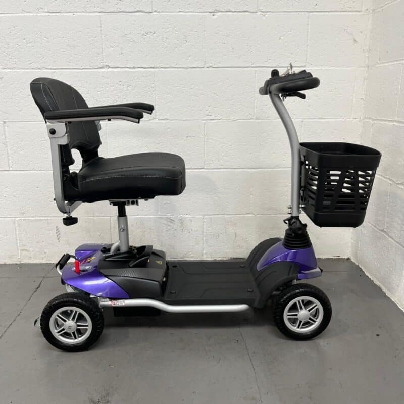 Photo of the Right Side of a Purple and Black, Motion Healthcare Evolite Second-hand Mobility Scooter. Motion Healthcare Evolite