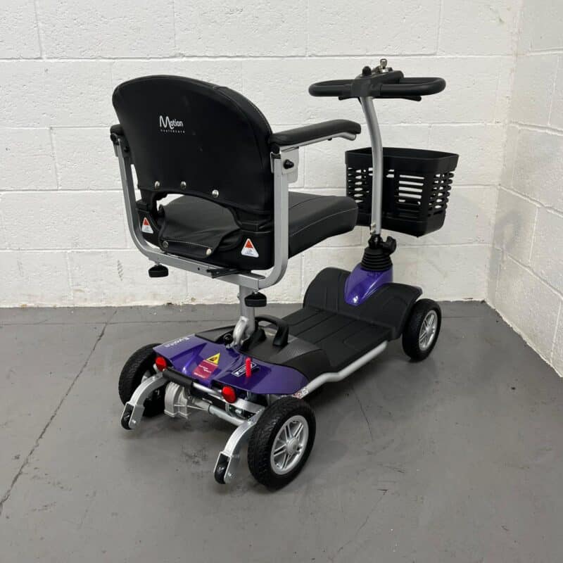 Photo Showing a Three-quarter View of the Right Side and Rear of a Purple and Black, Motion Healthcare Evolite Second-hand Mobility Scooter. Motion Healthcare Evolite
