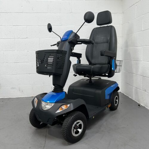 Photo Showing a Three-quarter View of the Left Side and Front of a Blue and Black Invacare Orion Pro Second-hand Mobility Scooter. Used Mobility Scooter Shop | Second Hand Mobility Scooters!