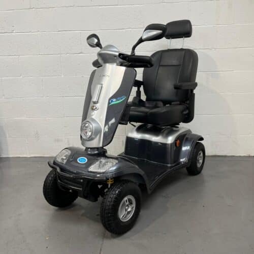 Photo Showing a Three-quarter View of the Left Side and Front of a Silver an Back, Kymco Maxi Xls Second-hand Mobility Scooter. Used Mobility Scooter Shop | Second Hand Mobility Scooters!