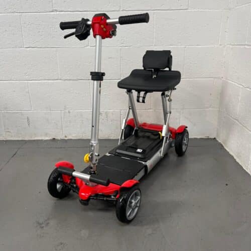 Photo Showing a Three-quarter View of the Left Side and Front of a Red and Black, Motion Healthcare Mlite Second-hand Mobility Scooter. Used Mobility Scooter Shop | Second Hand Mobility Scooters!