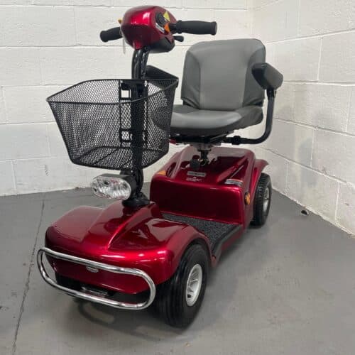 Photo showing a three-quarter view of the left side and front of a dark red Rascal 388 XL second-hand mobility scooter.