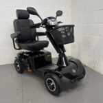 Photo Showing a Three-quarter View of the Right Side and Front of a Black Stirling S700 Second-hand Mobility Scooter. Sunrise Medical Sterling S700