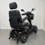 Photo Showing a Three-quarter View of the Right Side and Rear of a Black Stirling S700 Second-hand Mobility Scooter. Sunrise Medical Sterling S700
