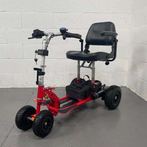 Photo Showing a Three-quarter View of the Left Side and Front of a Red and Black, Supascoota Sport Xl Second-hand Mobility Scooter. Terms & Conditions