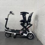 Photo of the Left Side of a White and Black Tga Minimo Second-hand Mobility Scooter. Tga Minimo