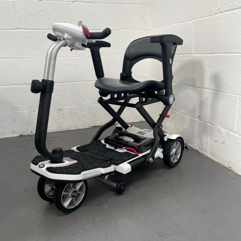 Photo Showing a Three-quarter View of the Left Side and Front of a White and Black Tga Minimo Second-hand Mobility Scooter. Tga Minimo